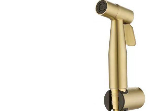 Gold handheld bidet and control valve on a white background