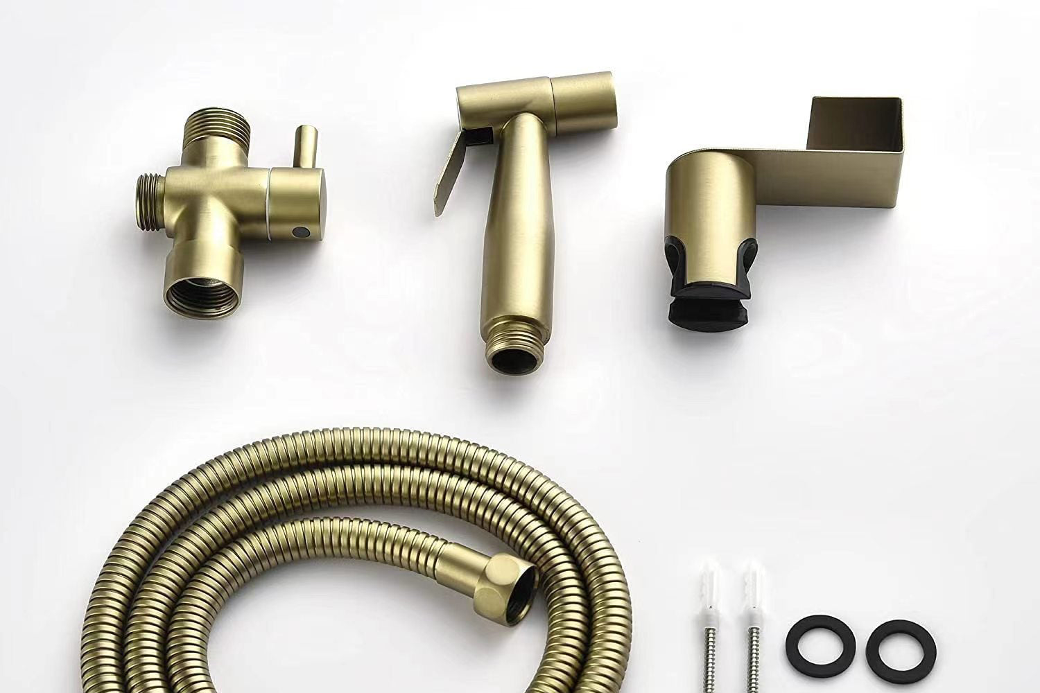Collection of brass bathroom fixtures and parts on a white background for the gold handheld bidet, 